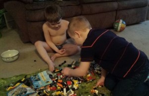 two boys playing legos