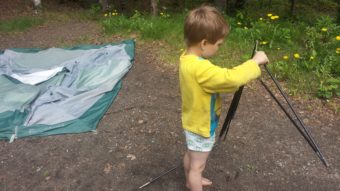 Helping Mommy take down the tent.