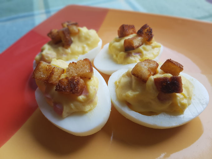 Deviled eggs Benedict on a plate