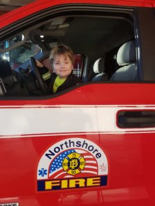 Fireman Duley in a North Shore FPD Vehicle