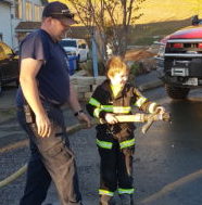 Child Sprays Fire Hose Sunny