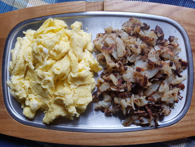top view of hash browns and scrambled eggs