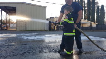 Child Sprays Fire Hose